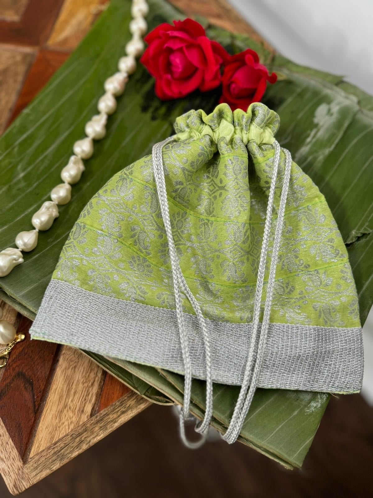 Parrot green Assam Silk Potli Bag with silver thread work