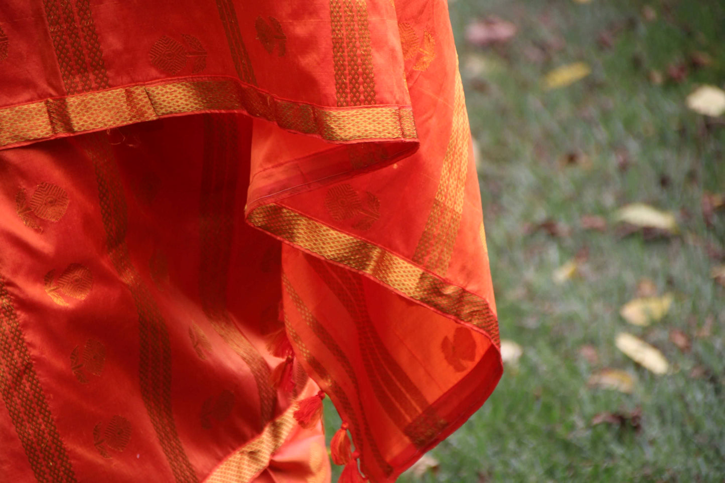 Orange and Gold Assam Silk Mekhela Chadar in flower and striped motifs