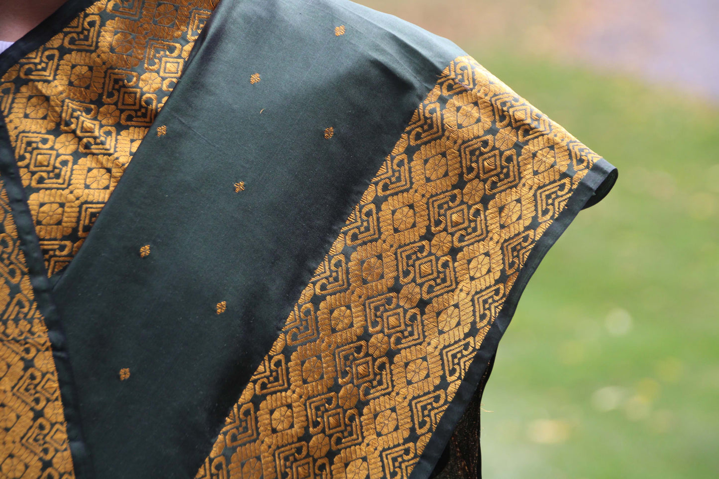 Assam silk bottle green mekhla chadar with thick woven border
