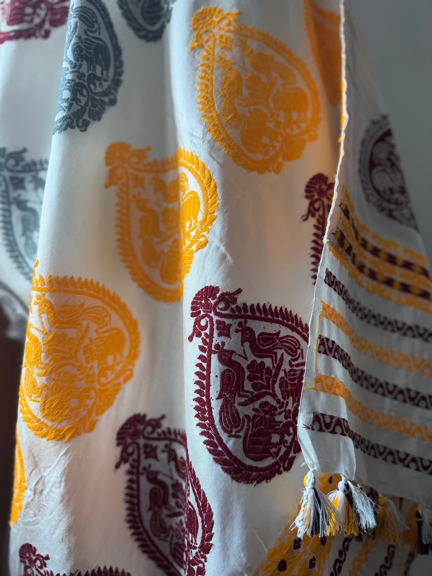 Assam Silk White saree in age old Khinkhap motifs in multi colors