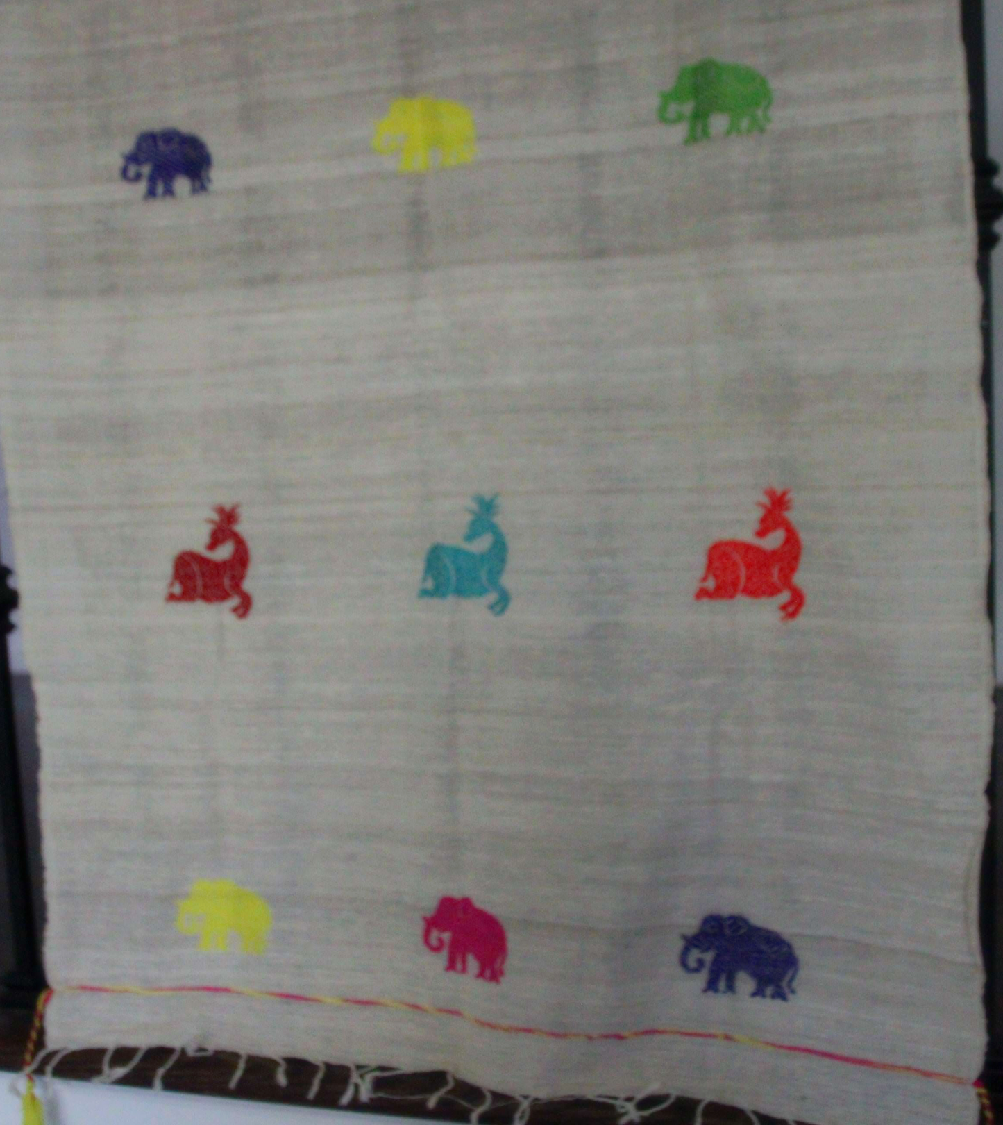 Eri Cotton scarf with multi color deer and elephant motifs.