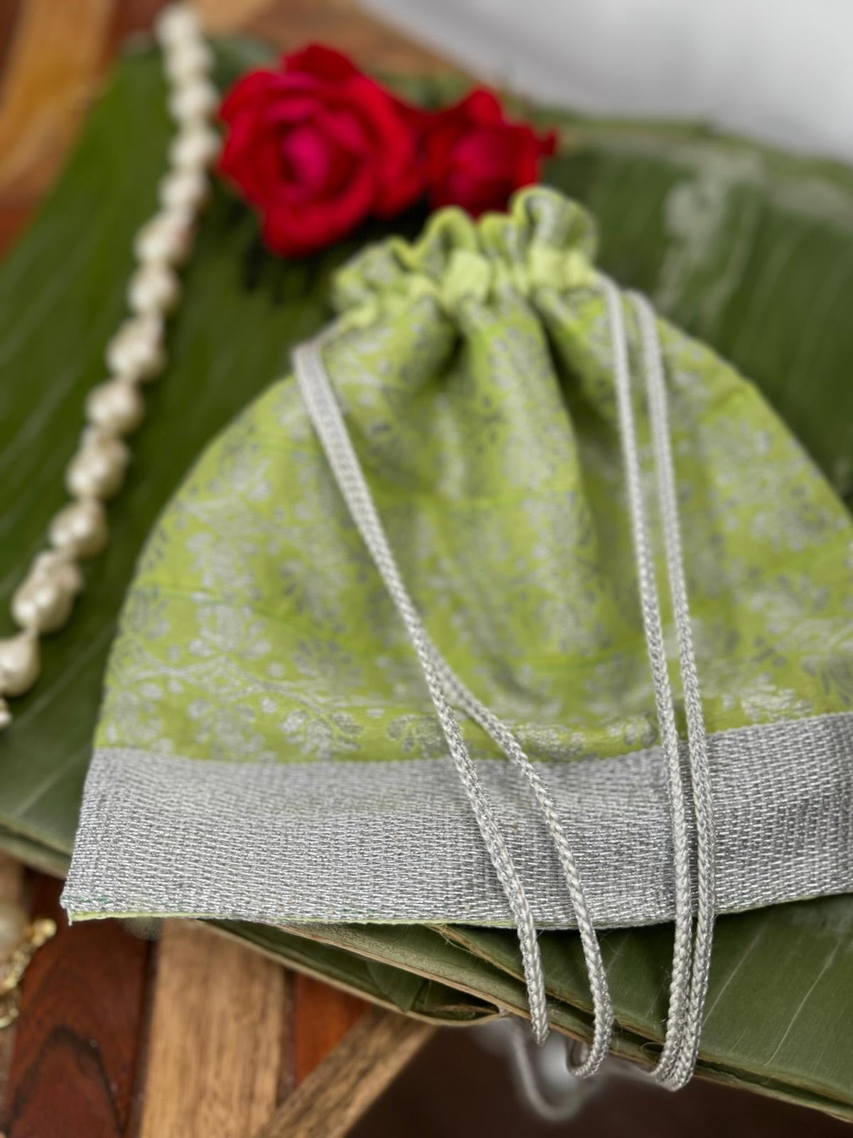 Parrot green Assam Silk Potli Bag with silver thread work