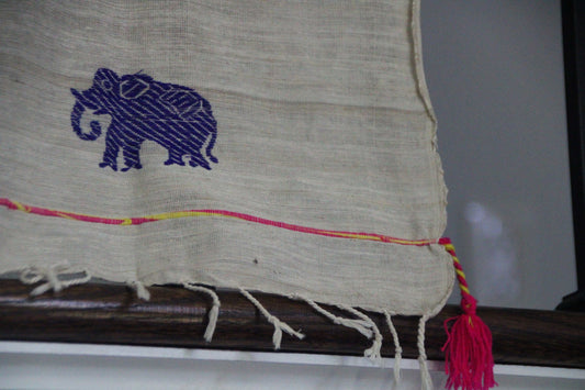 Eri Cotton scarf with multi color deer and elephant motifs.
